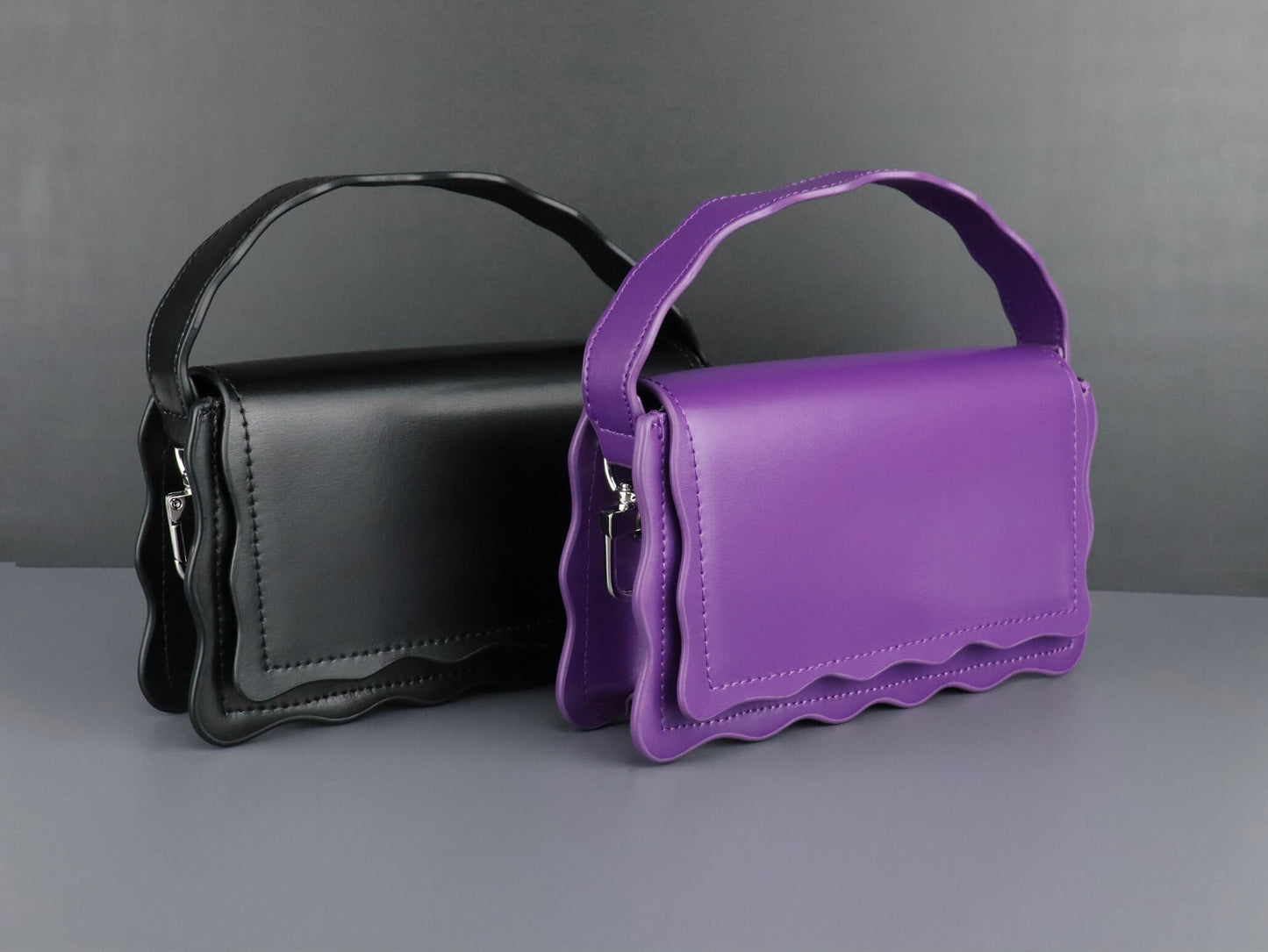 black and purple leather handbag