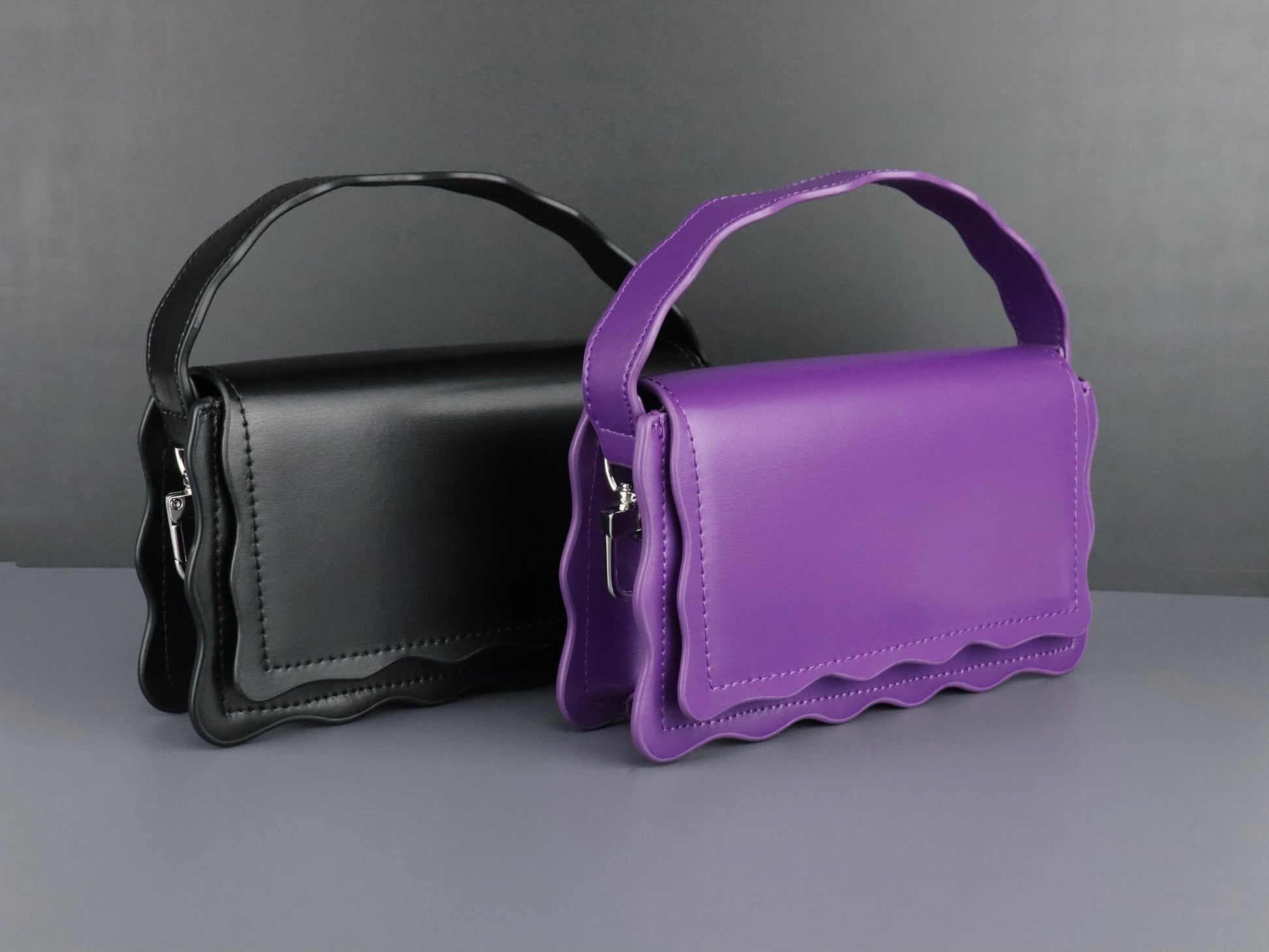 black and purple leather handbag