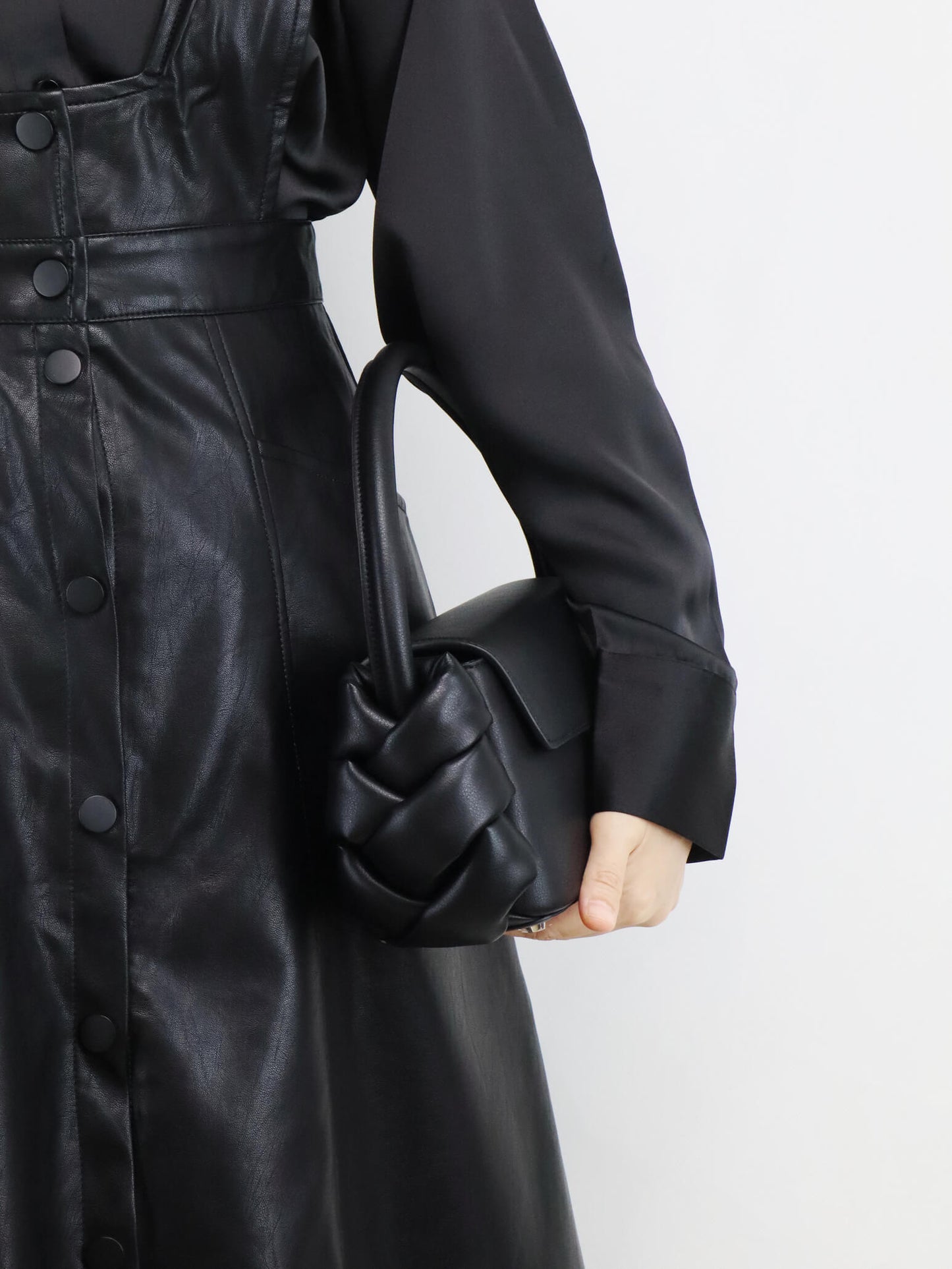 leather dress and leather handbag in black