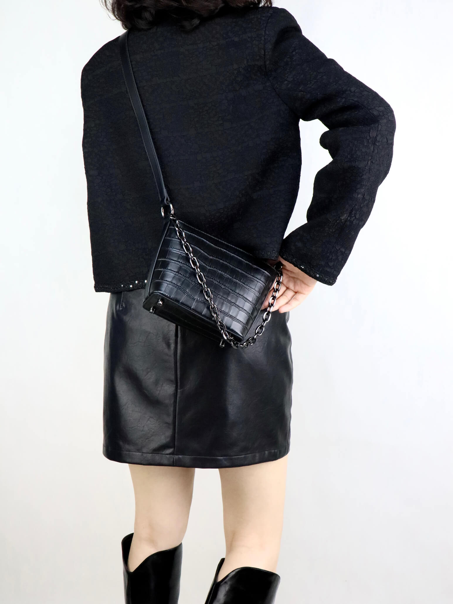 Black jacket with black leather bag